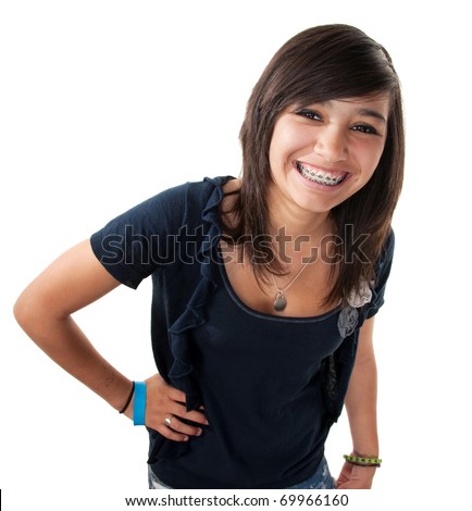 Cute hispanic teenage girl with braces and a big smile while hand on hip