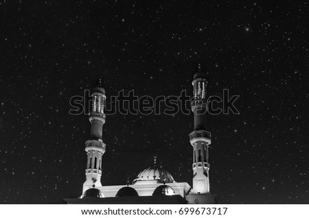 Mysterious mosque in black-and-white color against the background of the starry sky. Dubai, United Arab Emirates Royalty-Free Stock Photo #699673717