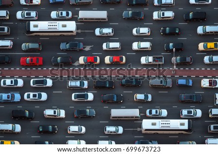 Top view of numerous cars in a traffic jam in Dubai, United Arab Emirates Royalty-Free Stock Photo #699673723