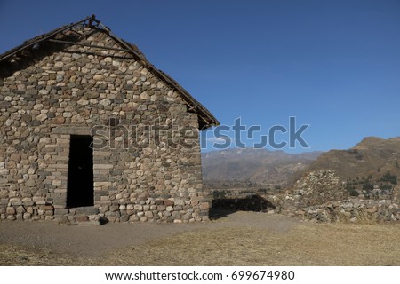Uyo Uyo archeological site, before inca empire, near to Yanque town in Colca Canyon, during de dry season at afternoon in a sunny day, Peru Royalty-Free Stock Photo #699674980