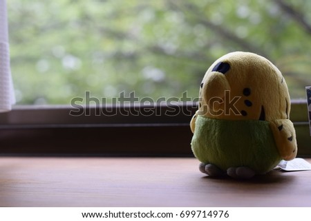 Toy; parrot and chair