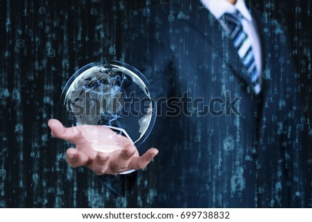 Young businessman shows a digital earth on his hand with an abstract data background. Business, Technology, Internet and network concept.  Royalty-Free Stock Photo #699738832