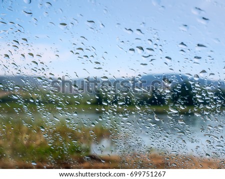 Selective focus and degradation of a background.Abstract texture background and drops of a rain on glass.