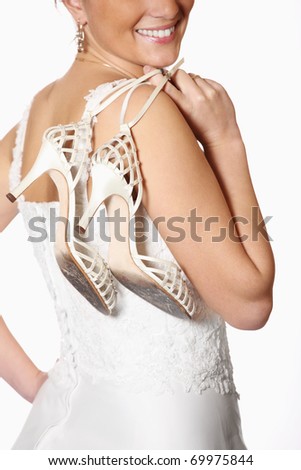 A picture of a bride and her worn-out shoes after the wedding party