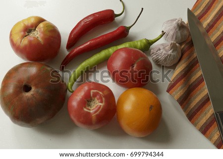 Vegan food. Tomatoes, Spicy Pepper and Garlic. White Background