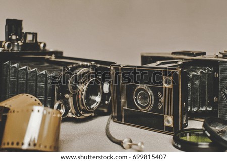 Old vintage retro camera still life on fabric background close up