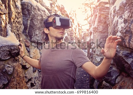 Young man with virtual reality glasses