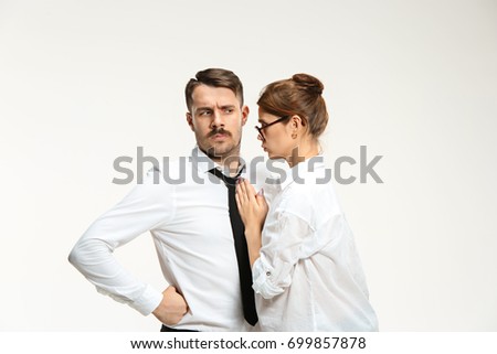 The young man and beautiful woman in business suit at office on white background
