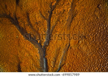 Bright orange sand background, color rusty metal