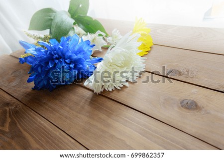 Colorful Chrysanthemum  and gerbera on the wooden background 