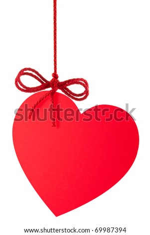 Heart-Valentine with a bow hanging on a rope. Isolated on white.