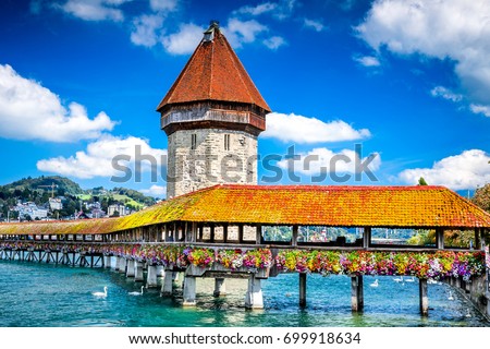 Lucerne, Switzerland - Famous wooden Chapel Bridge, oldest wooden covered bridge in Europe. Luzern, Lucerna in Swiss country. Royalty-Free Stock Photo #699918634
