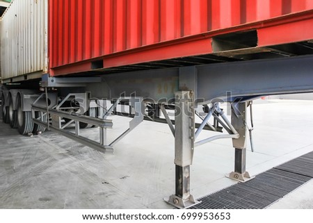 Cargo Transportation - Containers and trucks in the warehouse