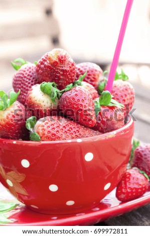 Strawberries inside a red cup