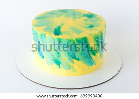 Cake with whipped yellow and green cream. Picture for a menu or a confectionery catalog.