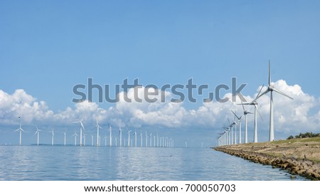 Windmill park Westermeerwind the largest wind farm offshore in the Netherlands. The wind farm produce 1.4 TWh of electricity, enough to provide electricity to over 400,000 households.,Netherlands Royalty-Free Stock Photo #700050703