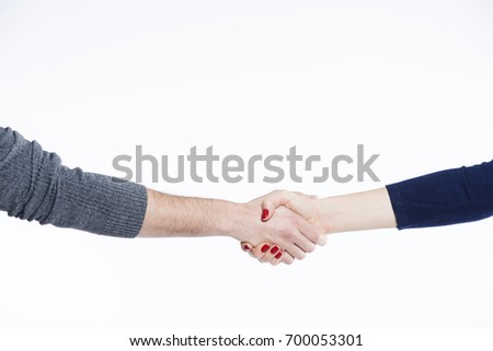 A woman and man hands handshaking