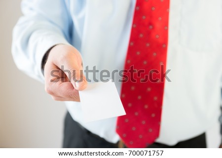 Man holding business card 