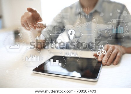 Applications icons and graphs on virtual screen. Business, internet and technology concept.