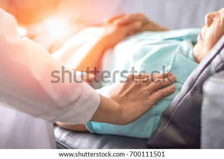 Healthcare concept of professional psychologist doctor consulting and comforting elderly patient in psychotherapy session or counsel diagnosis health. Royalty-Free Stock Photo #700111501