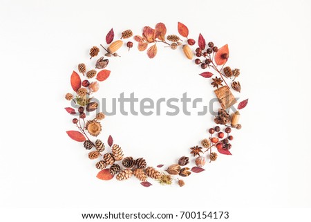 Autumn composition. Wreath made of autumn leaves, pine cones, anise star. Flat lay, top view, copy space.
