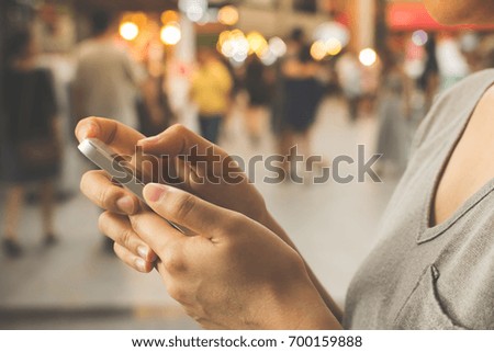 Close up image hand of happy woman are using a mobile phone