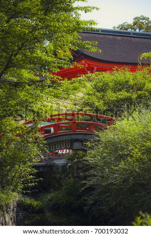 A round bridge in Kamigamo Jinja, the oldest Shinto shrine in the Ancient city of Kyoto and one of the 17 Historic Monuments which have been designated as a World Heritage Site. Kyoto, Japan