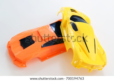 A crash scene with plastic toy car bodies