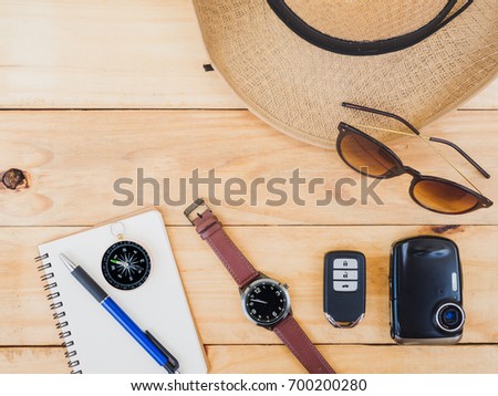 Travel planning concept background, Top view of Traveler's accessories, The essential vacation items on wooden, 
Concept Outfit and Travel background, Vintage style, space for copy text