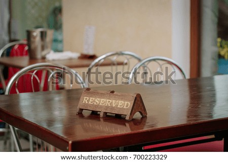 Reserved plate on table on a restaurant or cafe.