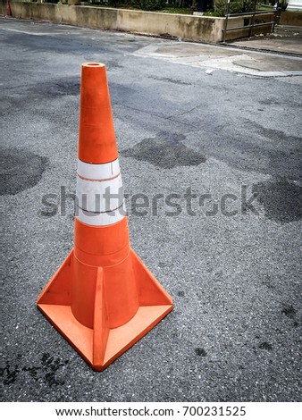 Traffic cone on the cement floor.