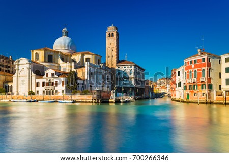 Venice, Italy. Grand Canal and Venetian old architecture against the clear blue sky on the background. Long exposure photography