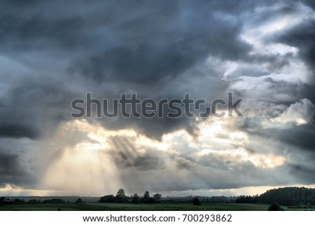 Interesting clouds, beautiful forest with sky view. Wonderful clouds in the fields. Lithuania nature with trees, fields and sky. Amazing landscape in Europe. Litva country beauty. Clouds flying. 
