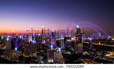 pin flat above night cityscape and glowing networking connection as communication concept Royalty-Free Stock Photo #700322089