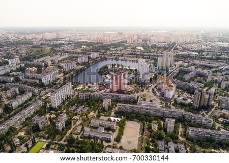 Residential district in a large metropolis with road junctions and houses. Aerial view. From above.