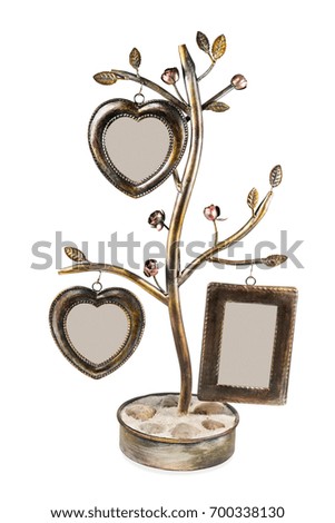 Decorative wrought-iron frame with photo frames in the shape of heart isolated on white background