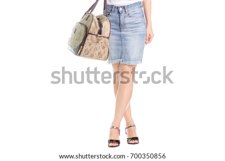 Legs in shoes young girl travel bag on white background isolation