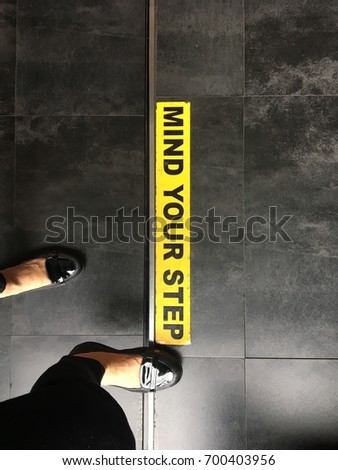 Mind your step warning sign
