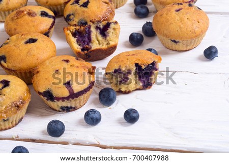 Banana muffins with blueberry on rustic background . copy space