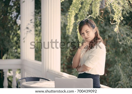 Asian girl business thinking idea for a new project, freelance thinking idea for a new project in selective focus.