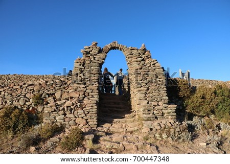 Arch of Amantani Island in Pachatata´s temple, Lake Titicaca, Peru, on a sunny day during the dry season Royalty-Free Stock Photo #700447348