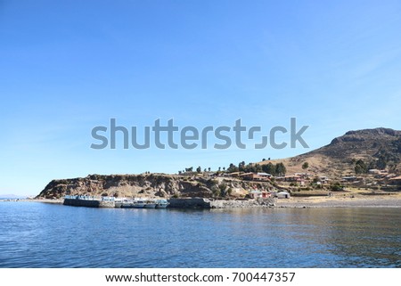 Port of Amantani Island, in Titicaca Lake, Peru Royalty-Free Stock Photo #700447357
