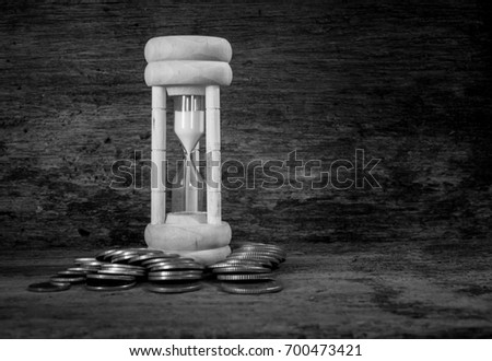 still life hourglass and money,Concepts, time and money idea