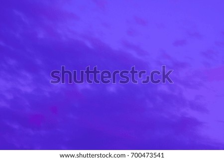 Light clouds colored in lavender against a purple sky makes this photo a great abstract background to build upon.