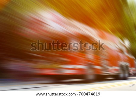 Fire truck in the motion. Abstract view.
