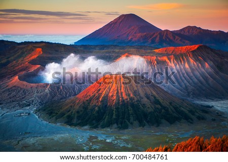 Mount Bromo, is an active volcano and part of the Tengger massif, in East Java, Indonesia. Royalty-Free Stock Photo #700484761