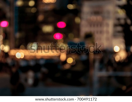Abstract blur image of people walking in night street , Hong Kong
