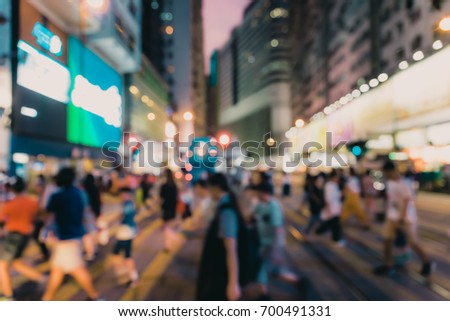 Abstract blur image of people walking in night street , Hong Kong
