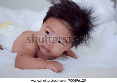 asian baby on the bed, Portrait cute baby asian. 