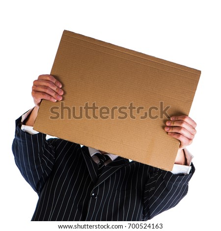Businessman holding a cardboard sheet of paper isolated on a white background